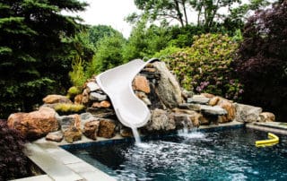 Custom stonework for pool and waterslide