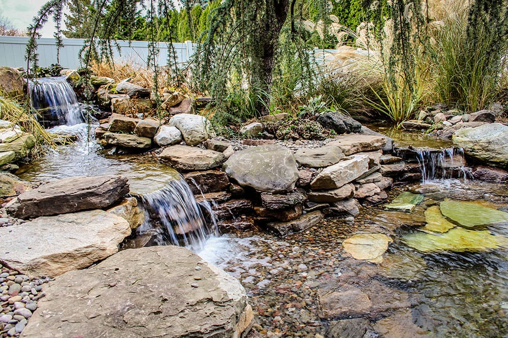 Large waterfall with koi pond